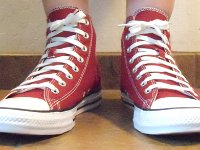 Chili Paste Red High Top Chucks  Wearing chili paste red high tops, front view 1.